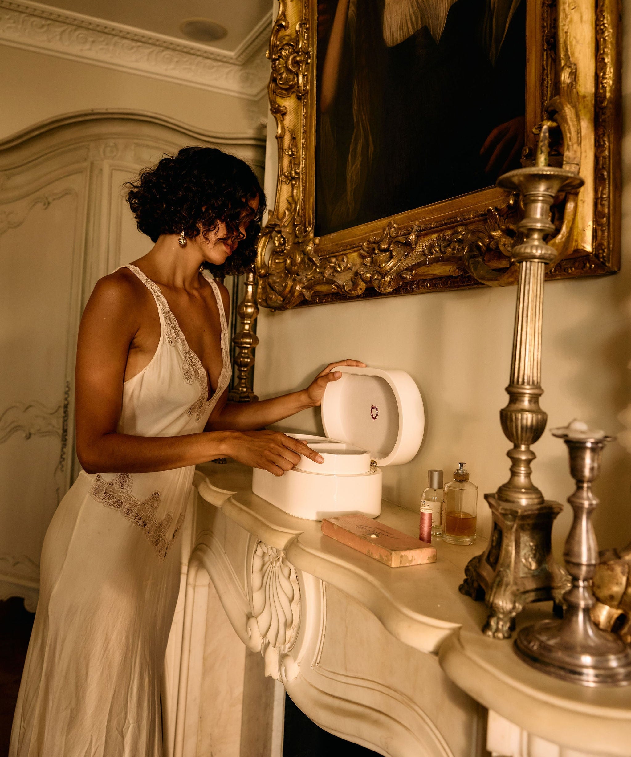Woman in a white dress interacting with a toilet in an ornate room.