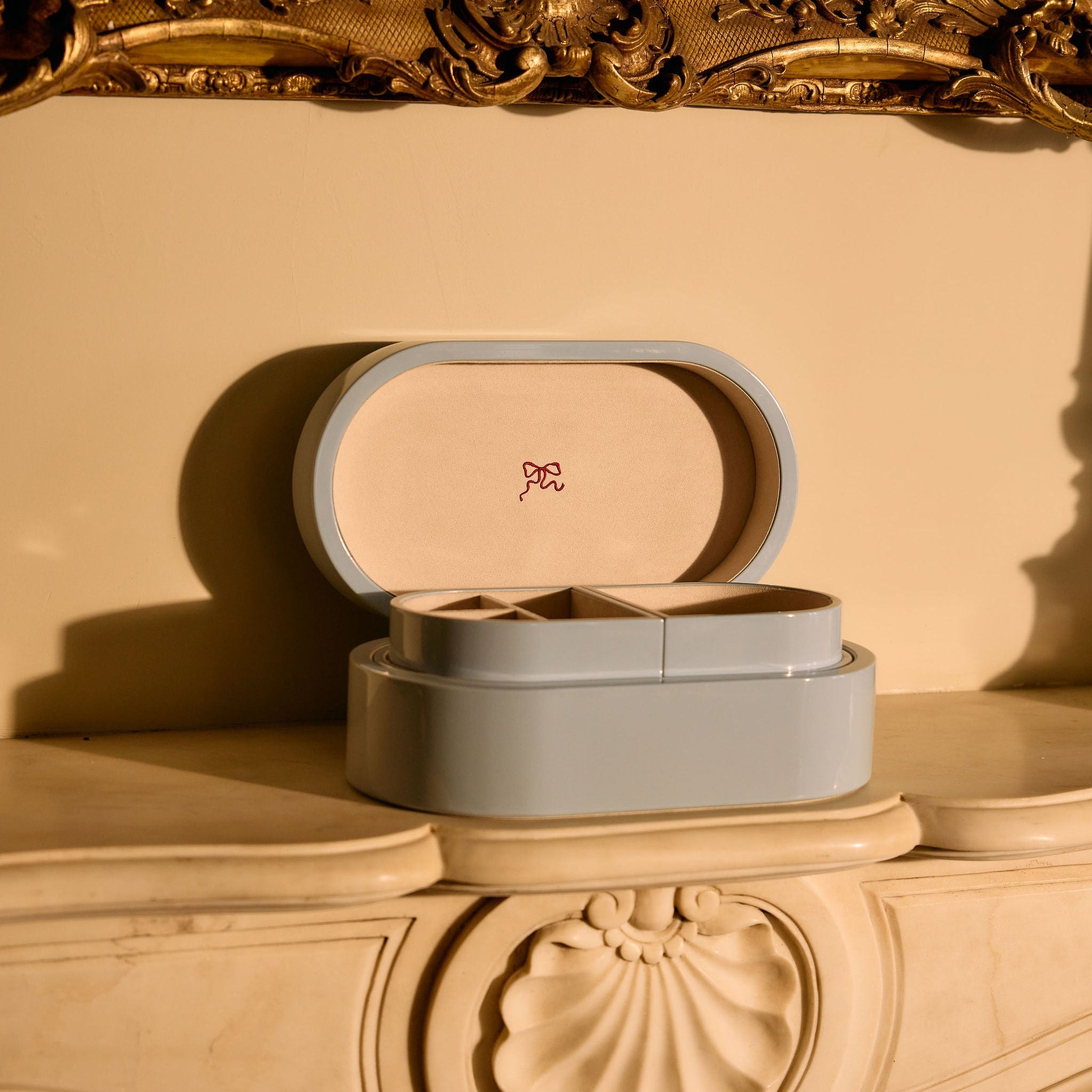 Open jewellery chest on mantle 