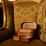 Wooden jewelry box on a patterned chair