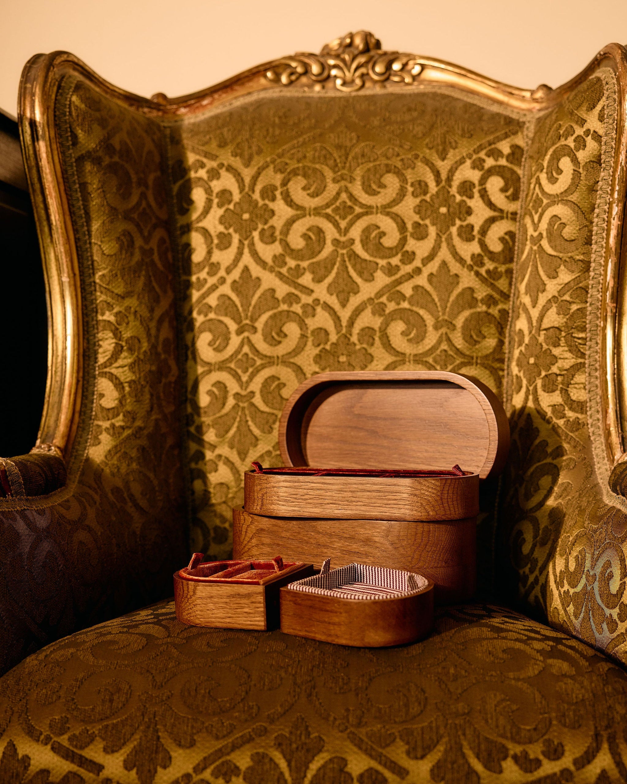 Wooden jewelry box on a patterned chair